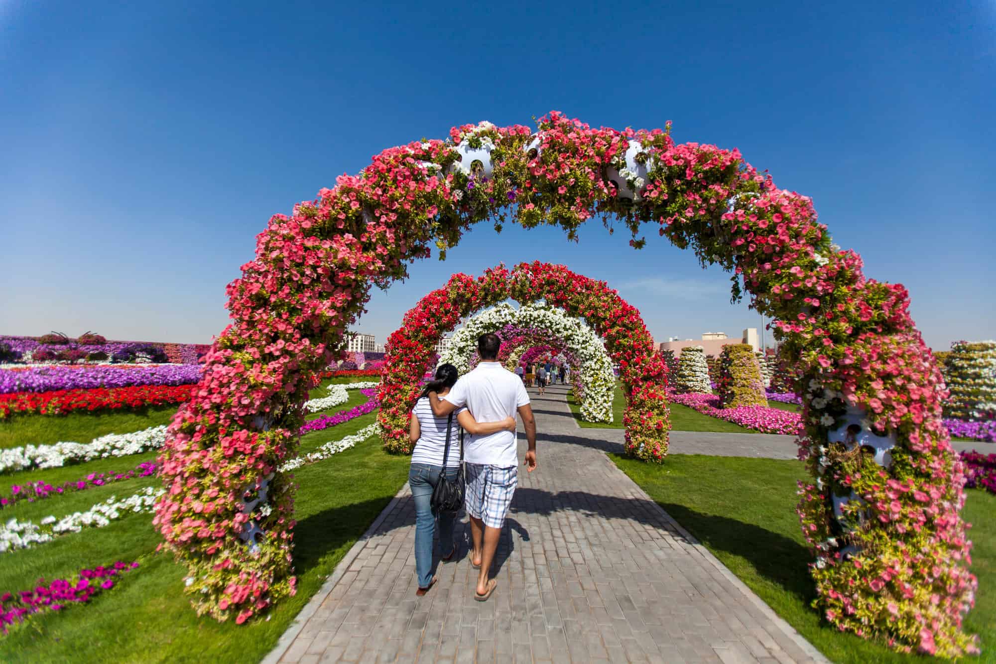 Couple walking in the Miracle Garden in Dubai, UAE